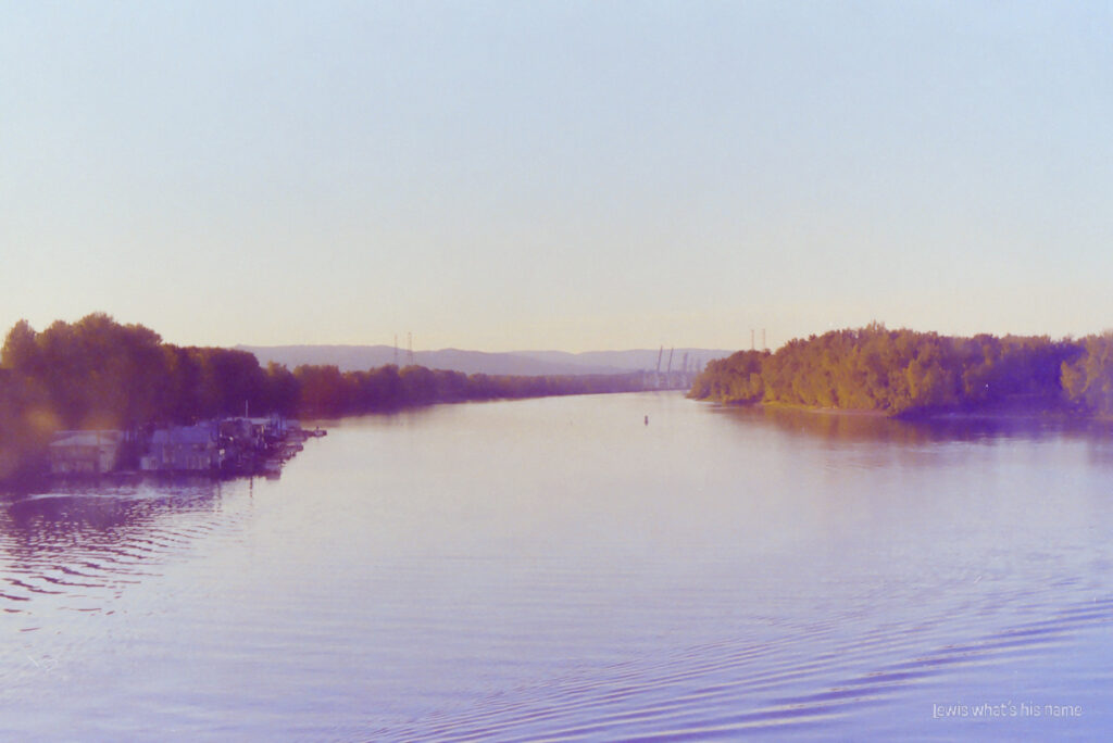 Photo of a river, with islands in the near distance.  Everything has an ethereal, pastel look.